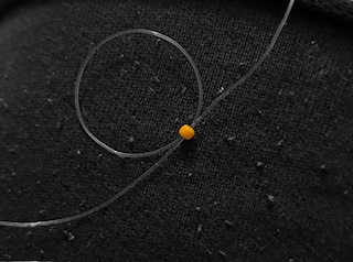Image of a cat beaded ring being made 