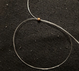 Image of a dog beaded ring being made
