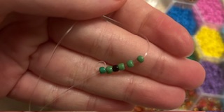 Image of frog beaded ring being made 