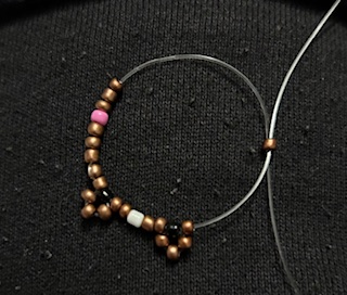 Image of a dog beaded ring being made