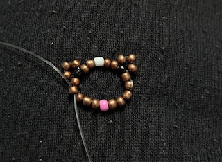 Image of a dog beaded ring completed 